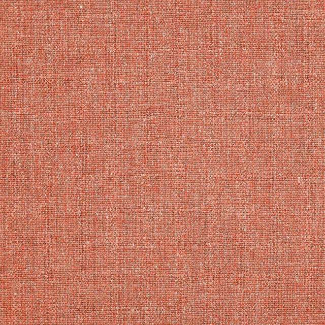 Soft coral-red woven fabric with a fine slubbed texture
