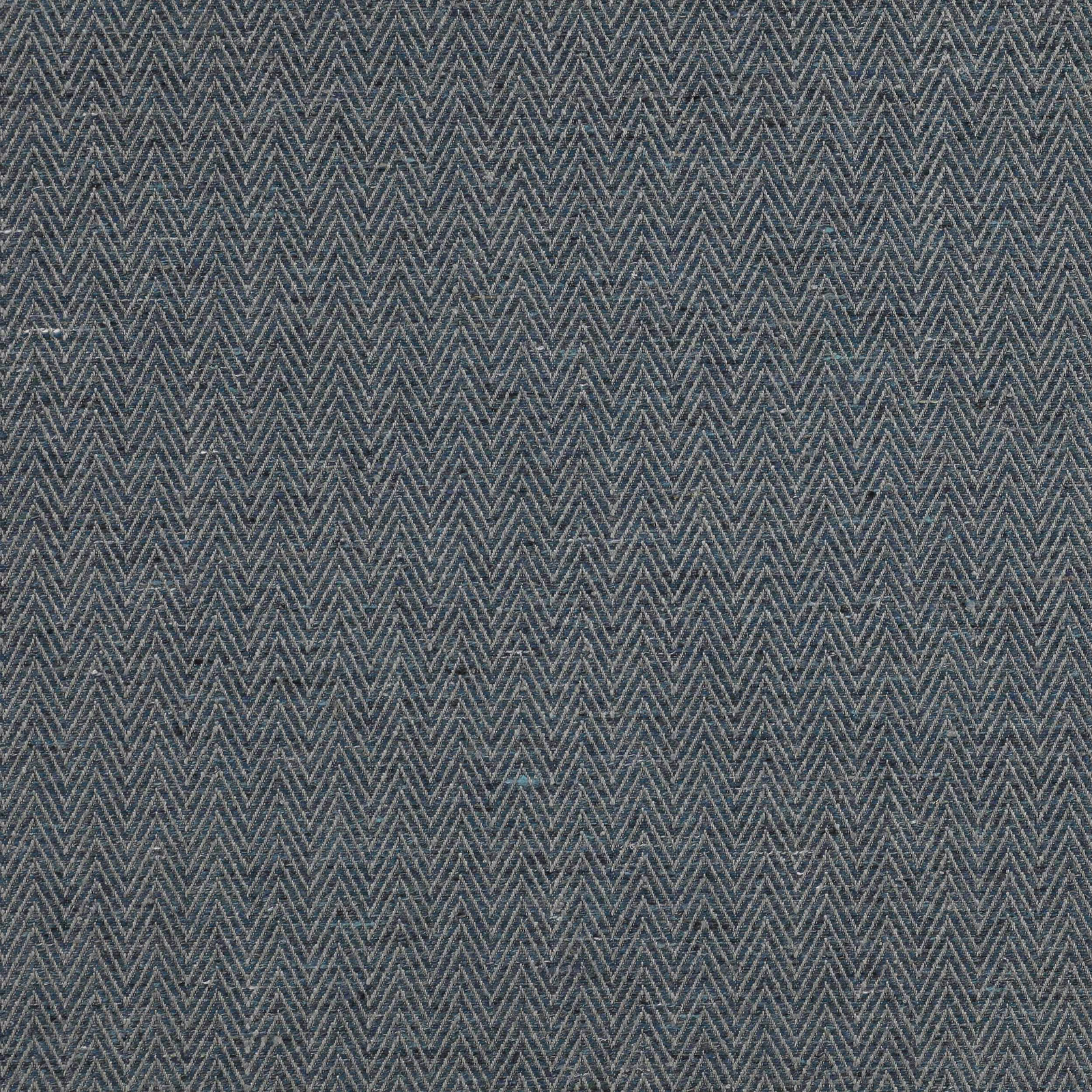 Close-up of muted slate-blue herringbone fabric with fine woven texture