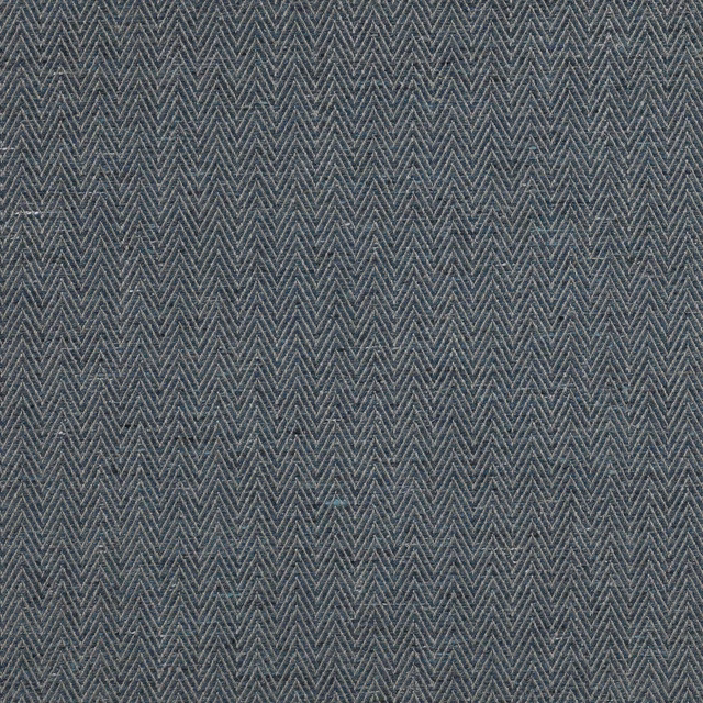 Close-up of muted slate-blue herringbone fabric with fine woven texture