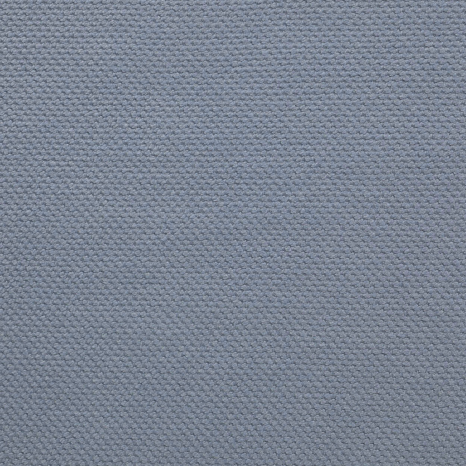 Close-up of a soft dusty blue woven fabric with a tight matte texture