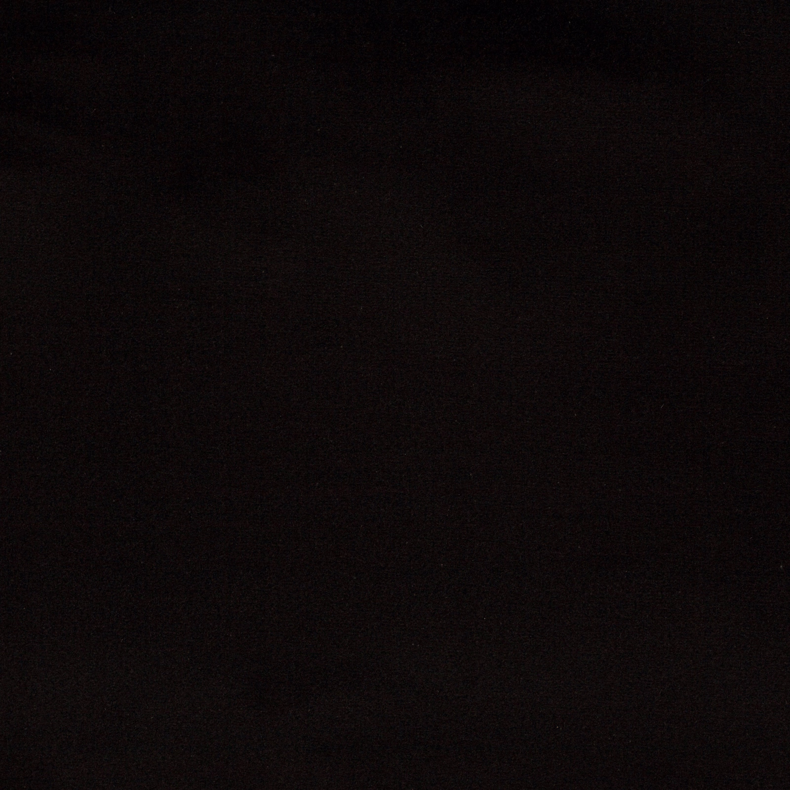 Dark charcoal black plain cotton fabric swatch with a matte woven texture