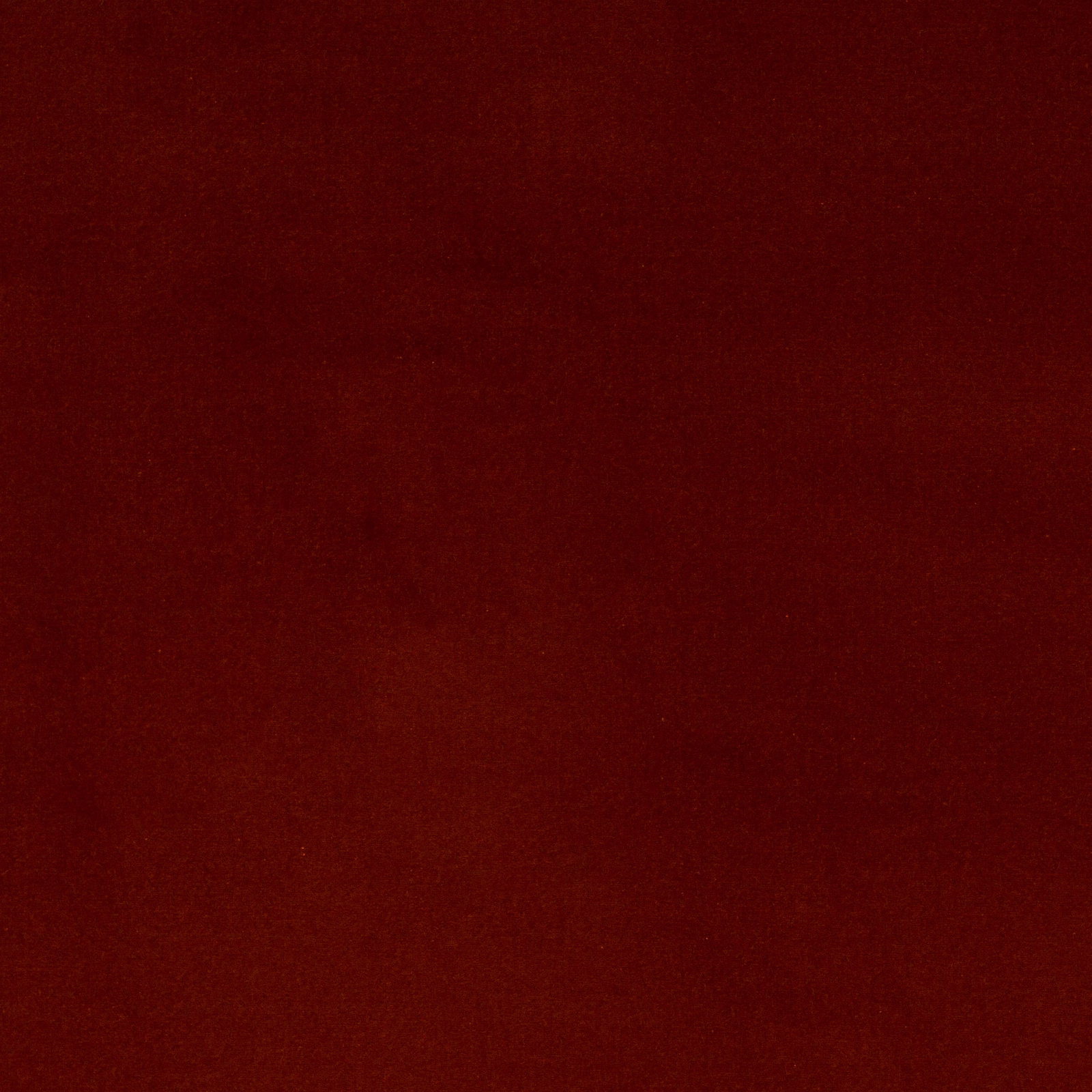 Deep copper-red plain cotton swatch with a smooth matte surface