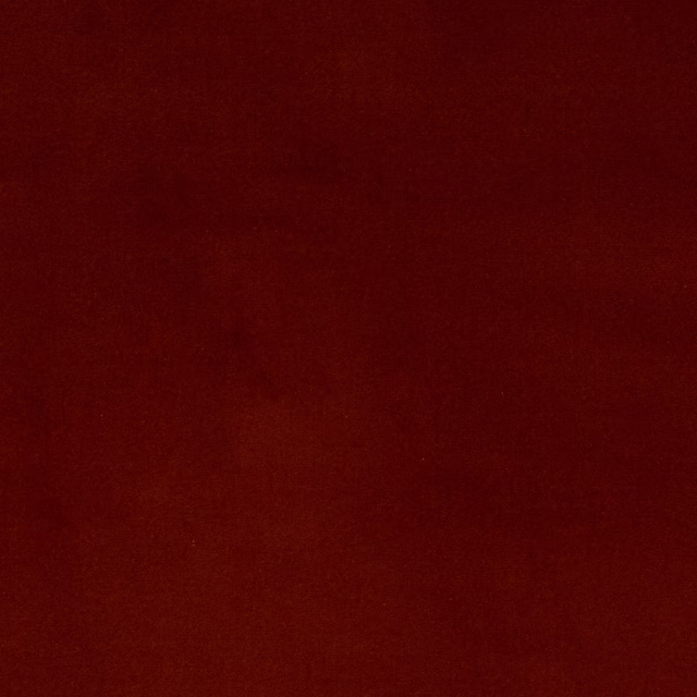 Deep copper-red plain cotton swatch with a smooth matte surface