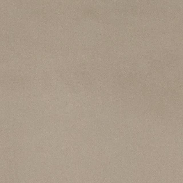 Plain soft warm beige cotton fabric swatch with a matte finish