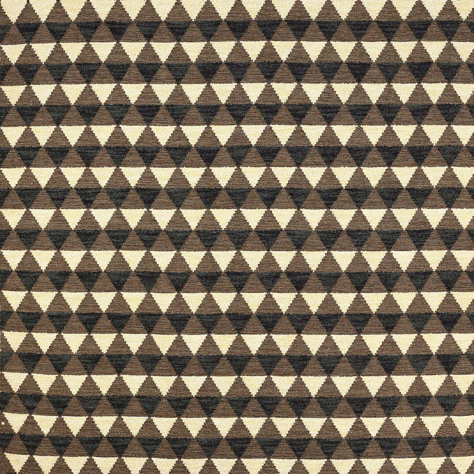 Close-up of small brown and beige triangle pattern on textured woven fabric