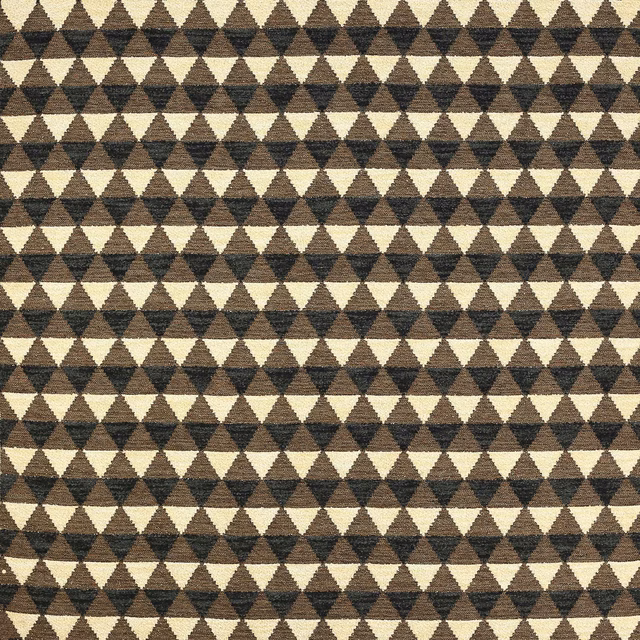 Close-up of small brown and beige triangle pattern on textured woven fabric