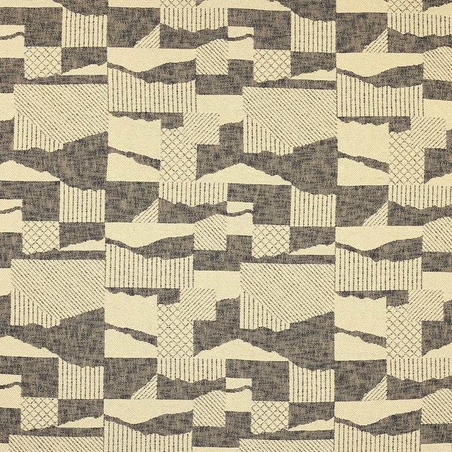 Geometric woven fabric in warm beige with smoky ebony blocks, stripes and patchwork motifs