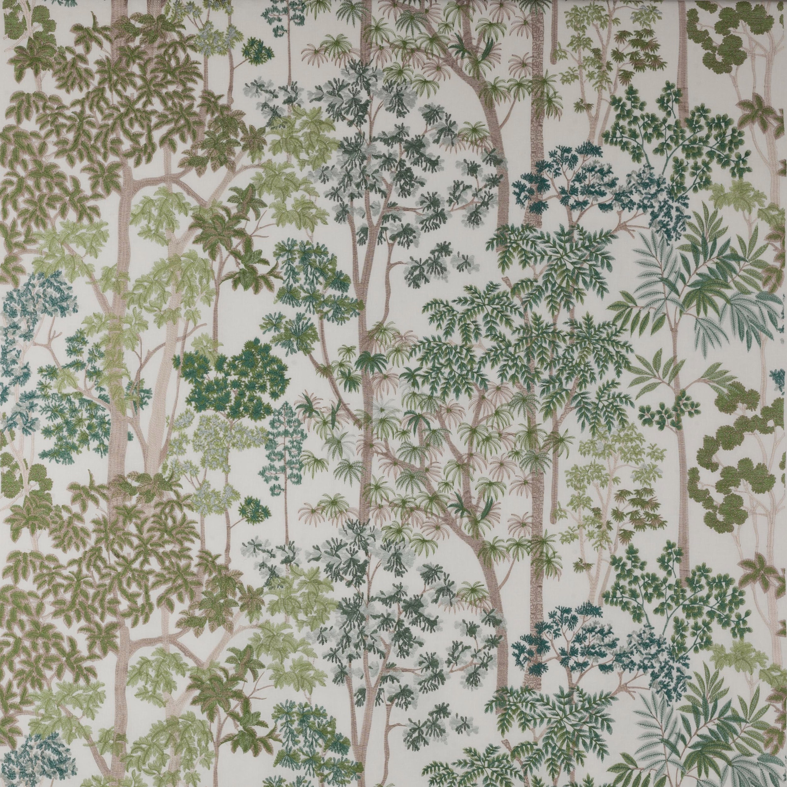 Embroidered tree motif fabric with soft green foliage and pale trunks on a light ground