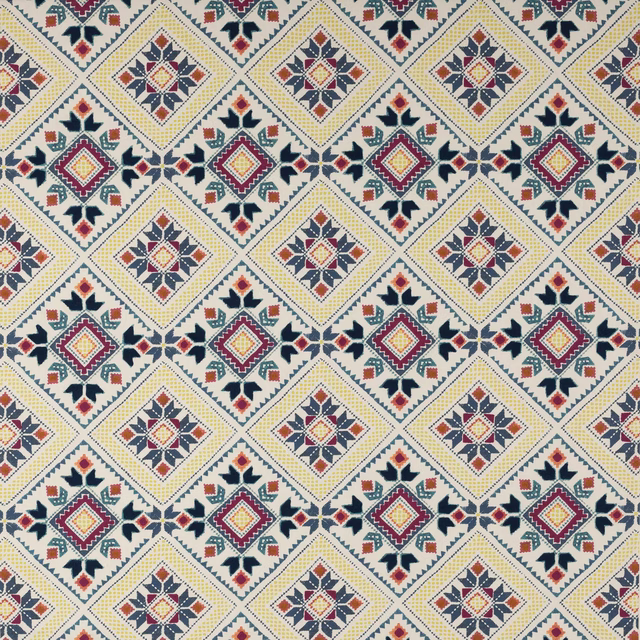 Cream geometric fabric with jewel-toned diamond motifs and repeated star pattern