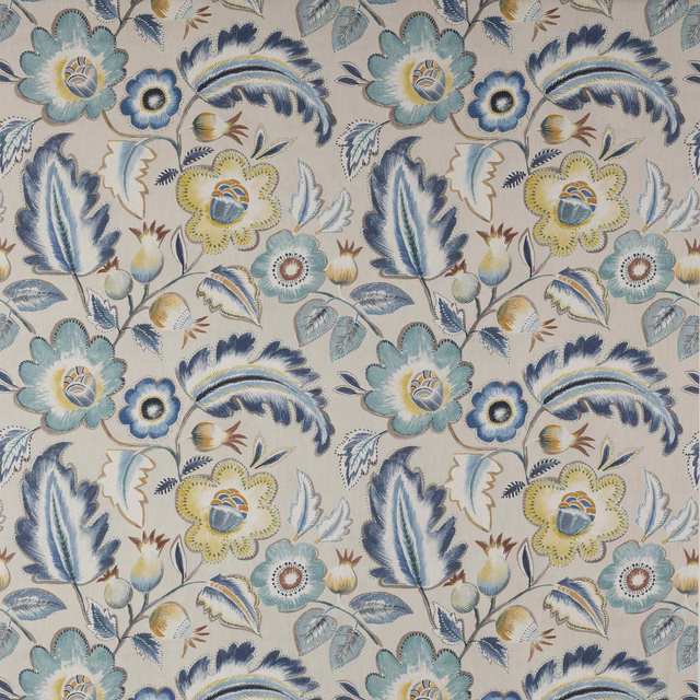 Large-scale botanical floral fabric with navy, blue, teal and ochre details on a pale ground