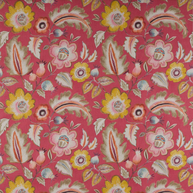 Large floral patterned fabric on a bright raspberry-red ground with cream, yellow and soft green blooms