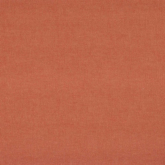 Close-up of a plain warm brick-red woven fabric with fine texture.