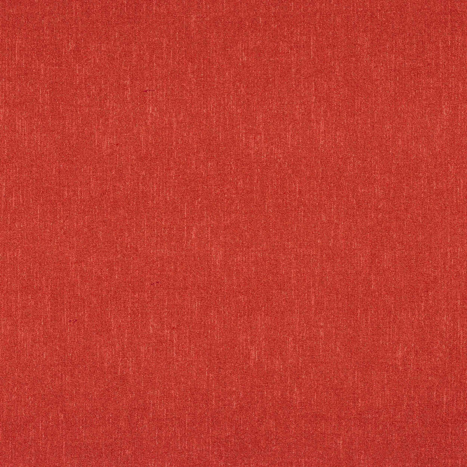 Close-up of warm coral-red plain weave fabric with fine slub texture