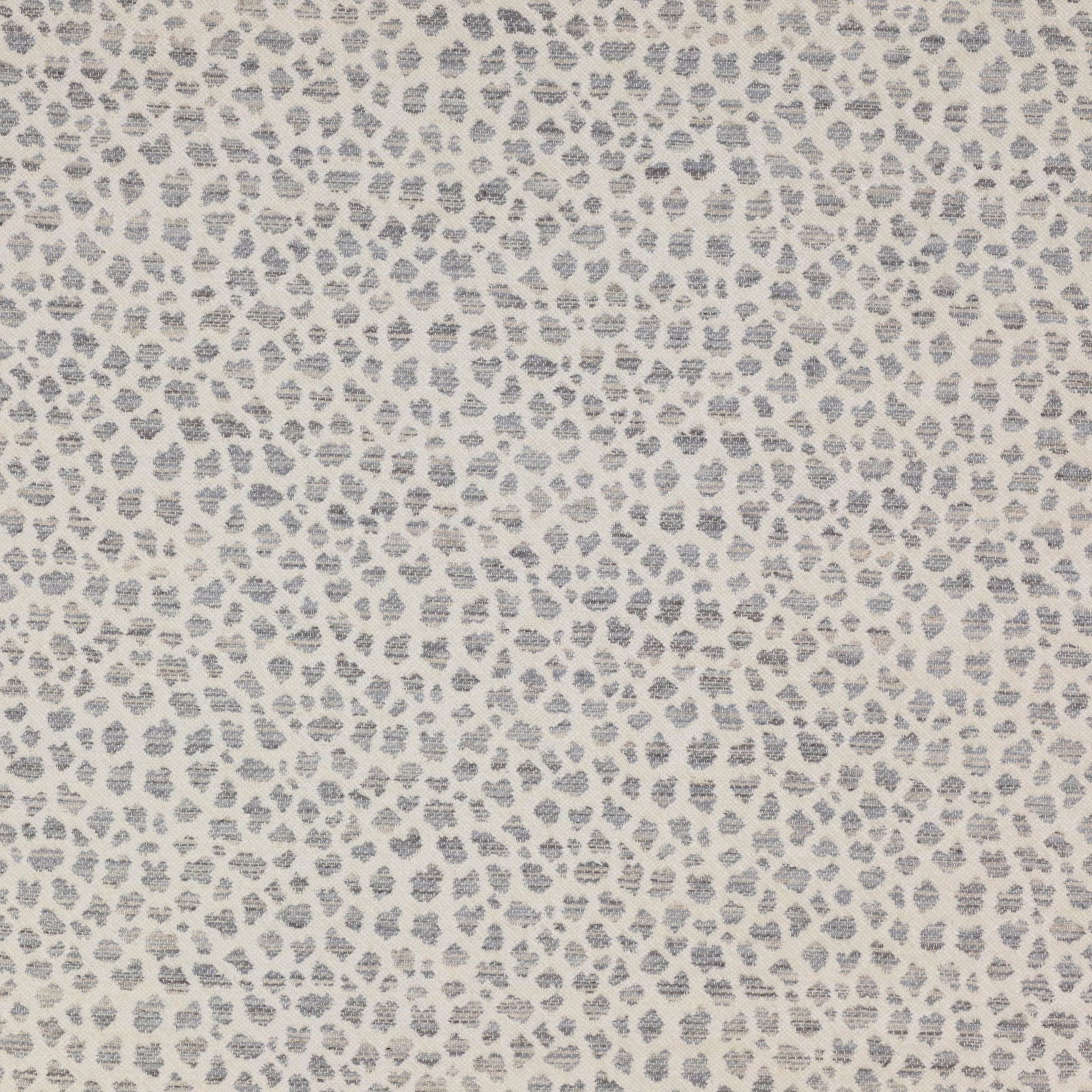 Small silver-grey leopard spot on a pale cream textured ground