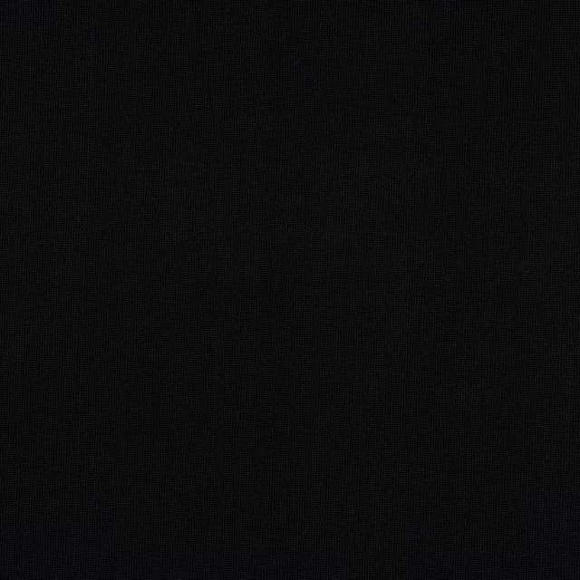 Close-up of deep black woven fabric with a fine matte texture