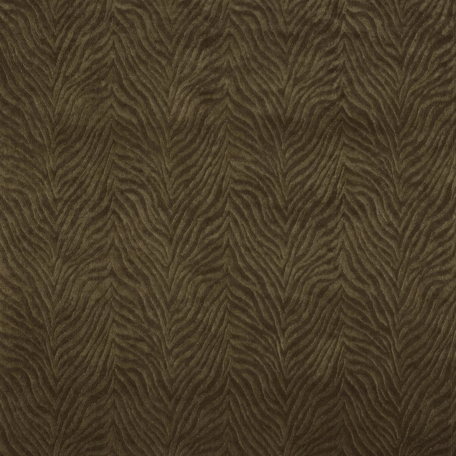 Close-up of warm chocolate-brown Kuba fabric with textured leaf-like woven motif