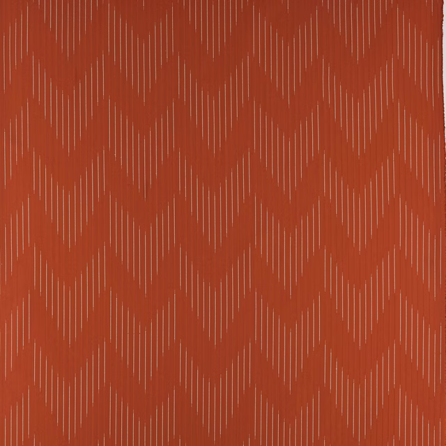 Terracotta chevron fabric with fine pale pinstripes and woven texture