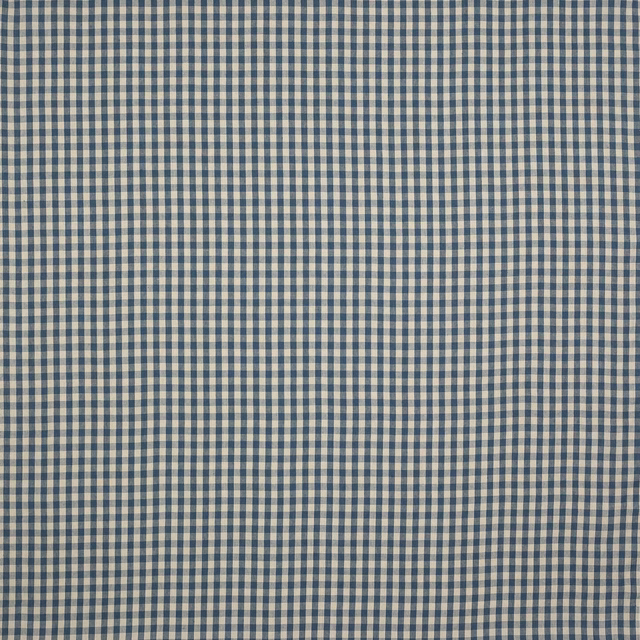 Close-up of small navy and cream linen check fabric with a matte weave