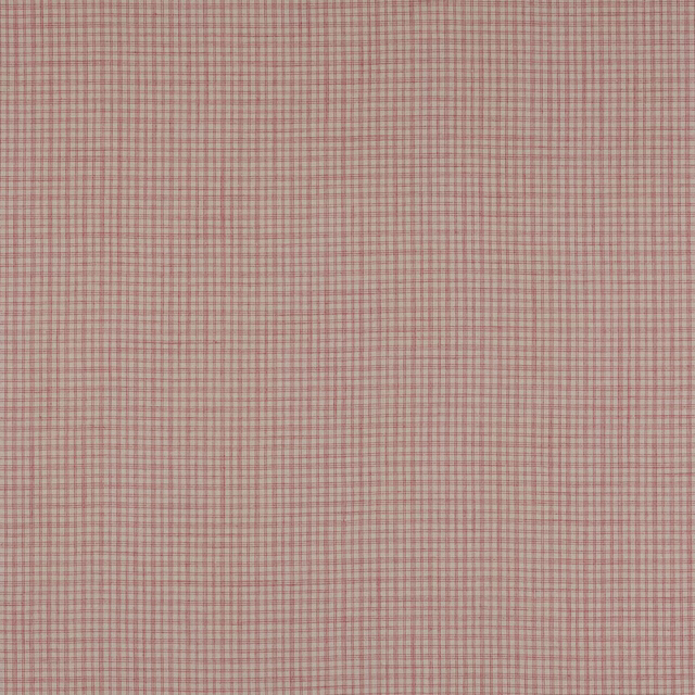 Close-up of a pale linen check fabric with muted pink-red grid lines
