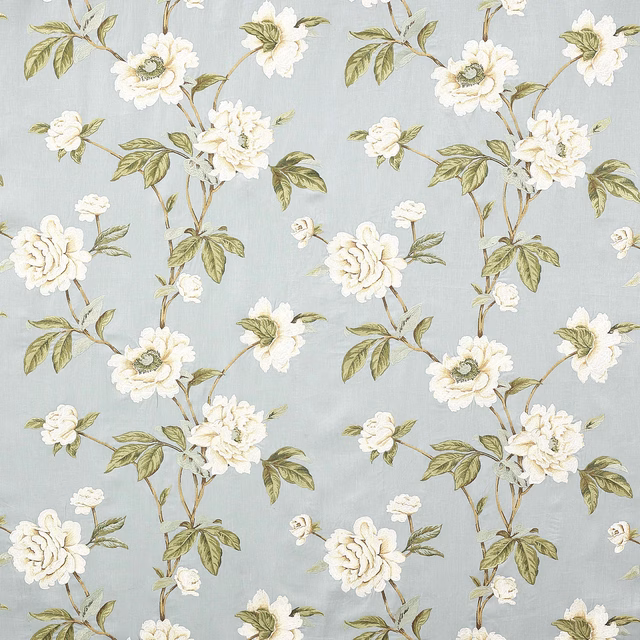 Pale blue floral fabric with ivory blooms and olive-green leaves on a woven ground