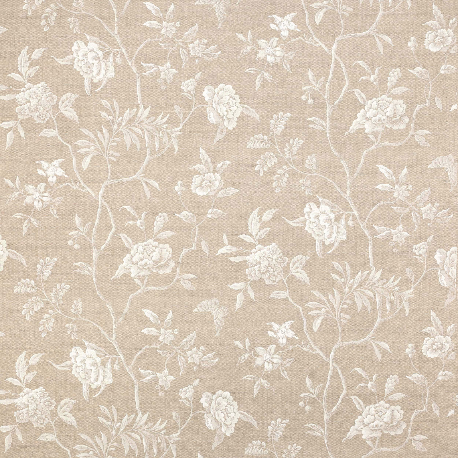 Beige botanical fabric with trailing pale ivory floral branches on a linen-textured ground