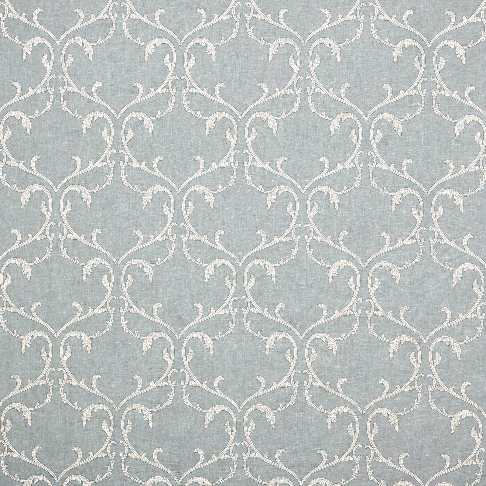 Pale old blue damask fabric with ivory scrolling vine motif and woven texture