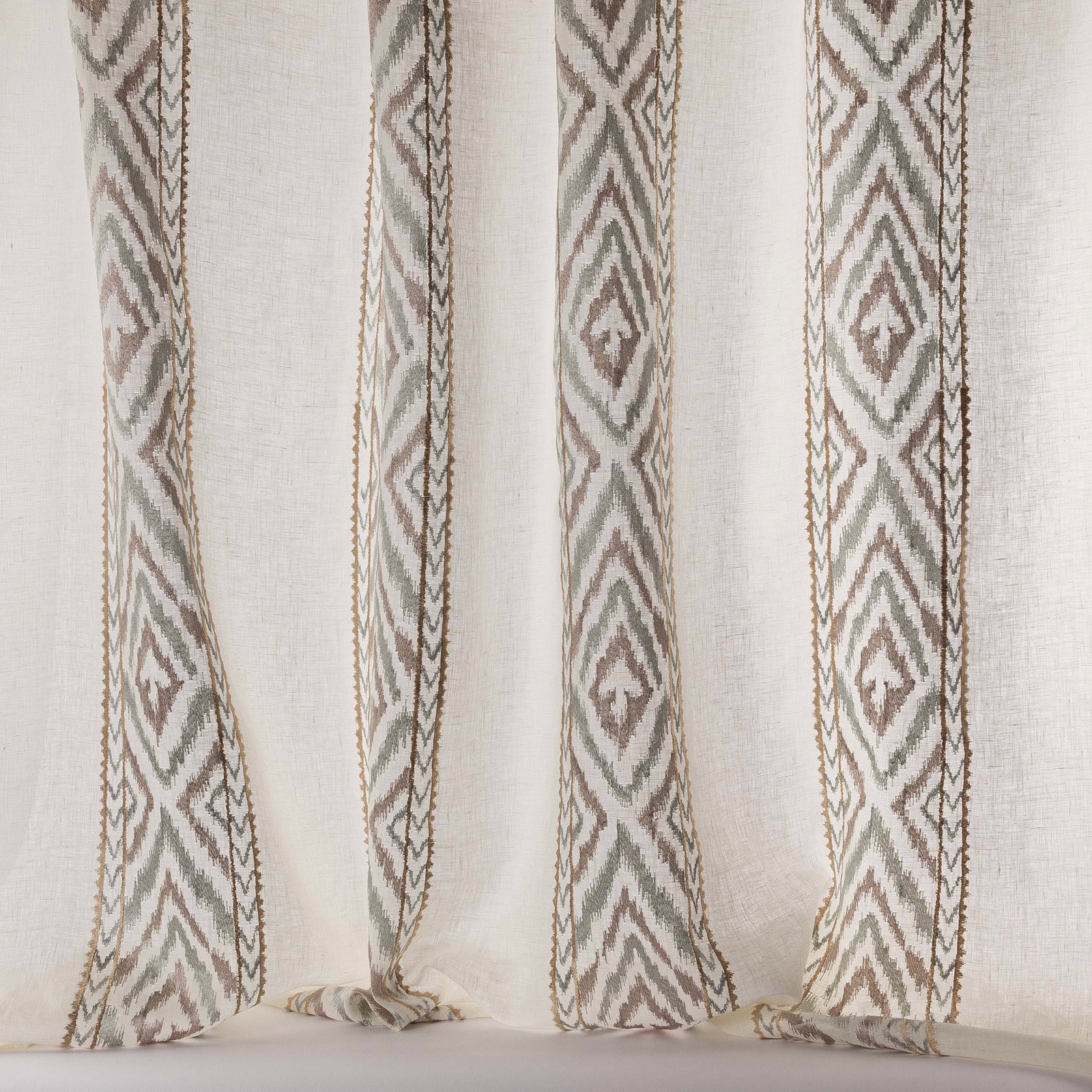 Sheer beige fabric with vertical geometric woven stripes in taupe and soft sage