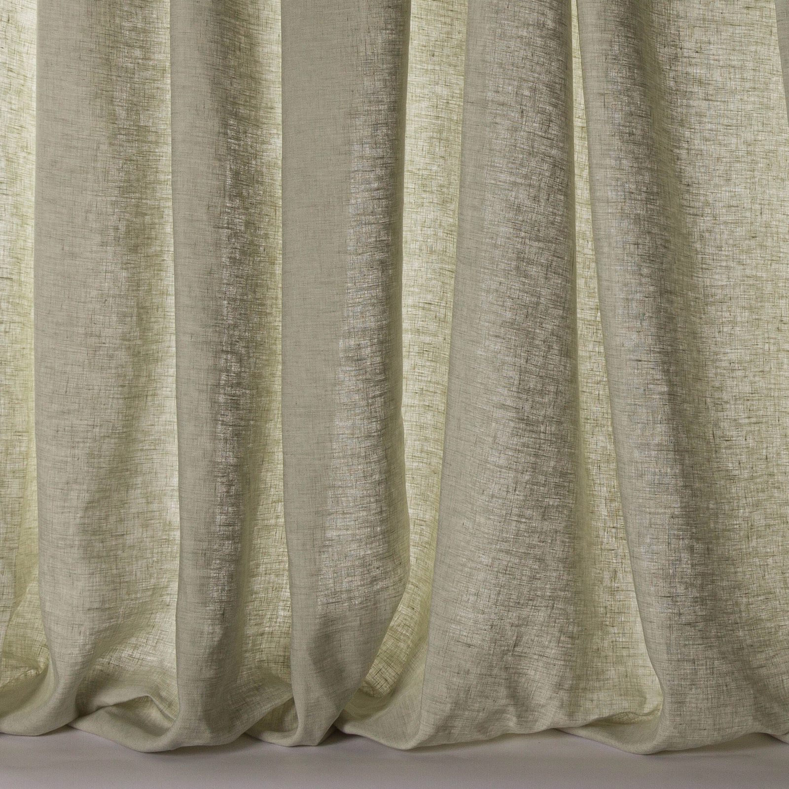 Pale aqua-green sheer linen curtain fabric with soft vertical folds