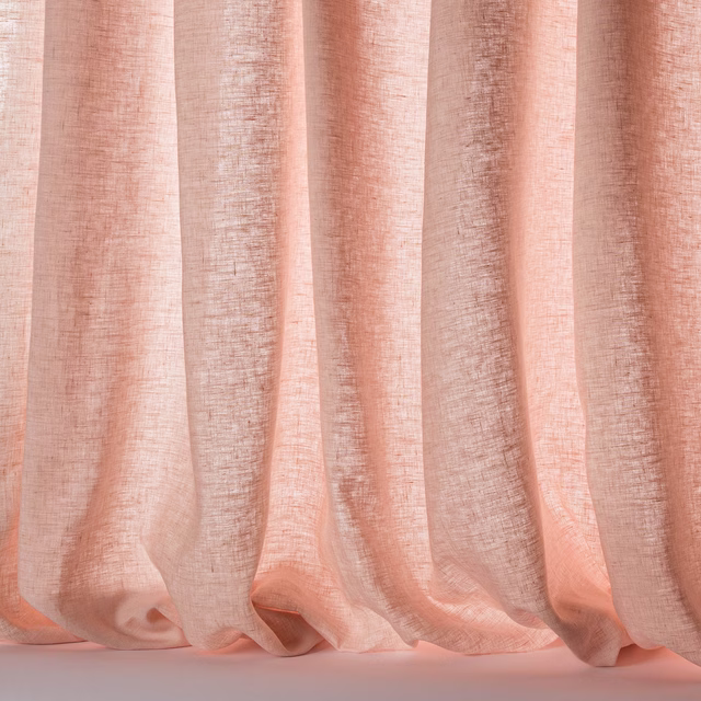 Soft peach-pink linen sheer fabric with a loose, slubbed weave and fluid folds