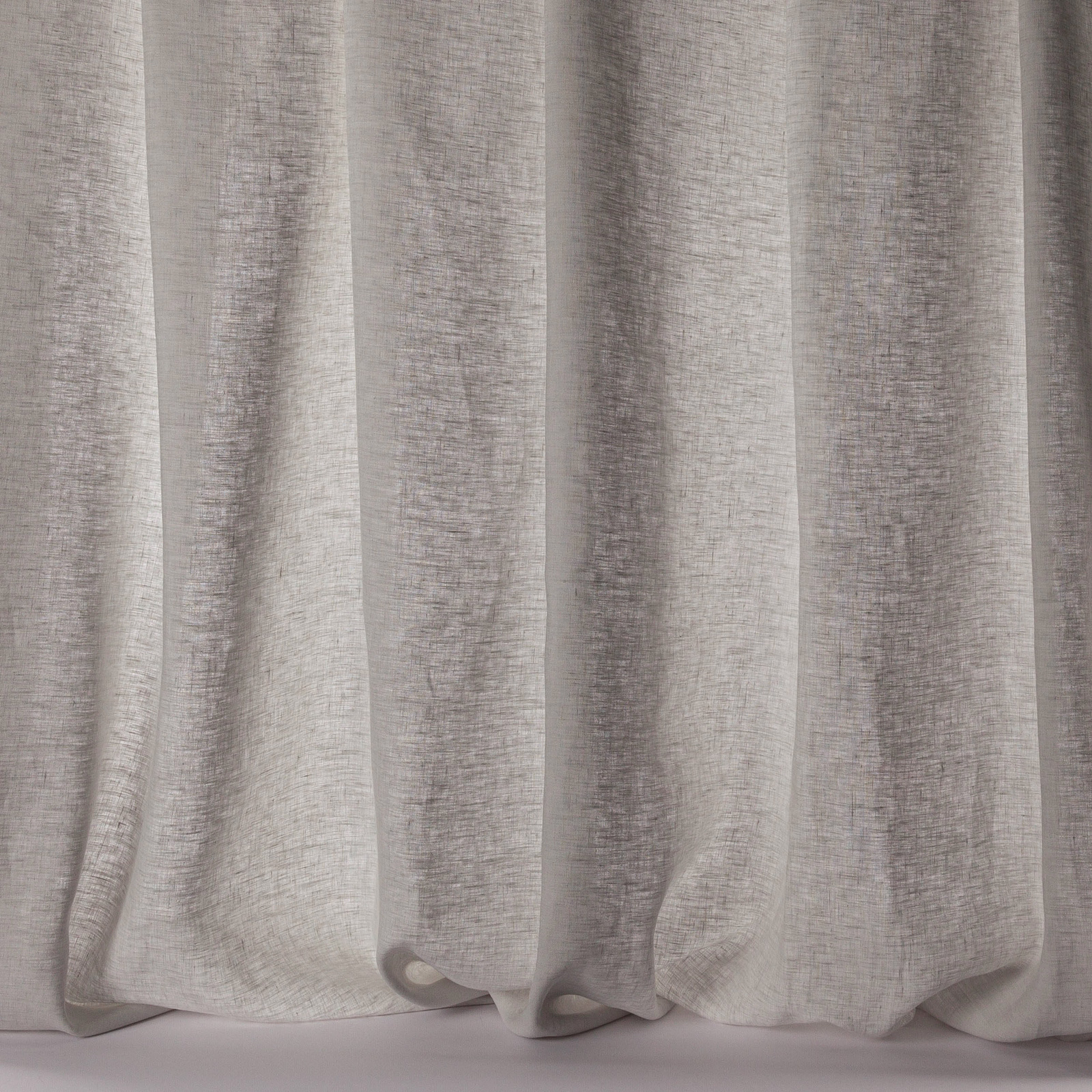 Pale silver-grey linen sheer draped in soft vertical folds