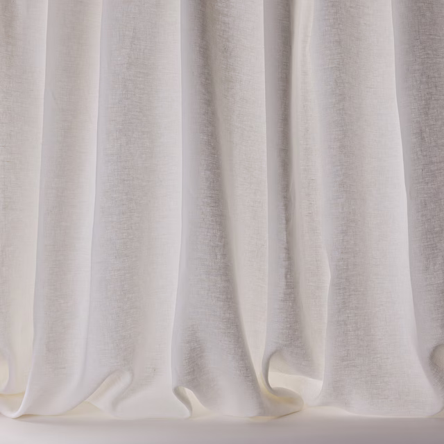 Soft white linen sheer curtains with a fine natural slub and flowing folds