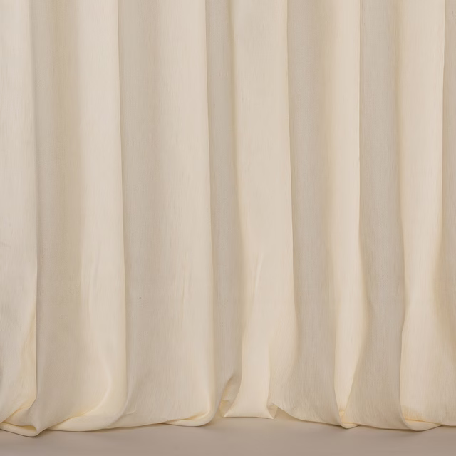 Ivory sheer fabric with soft vertical folds and a lightly textured linen finish
