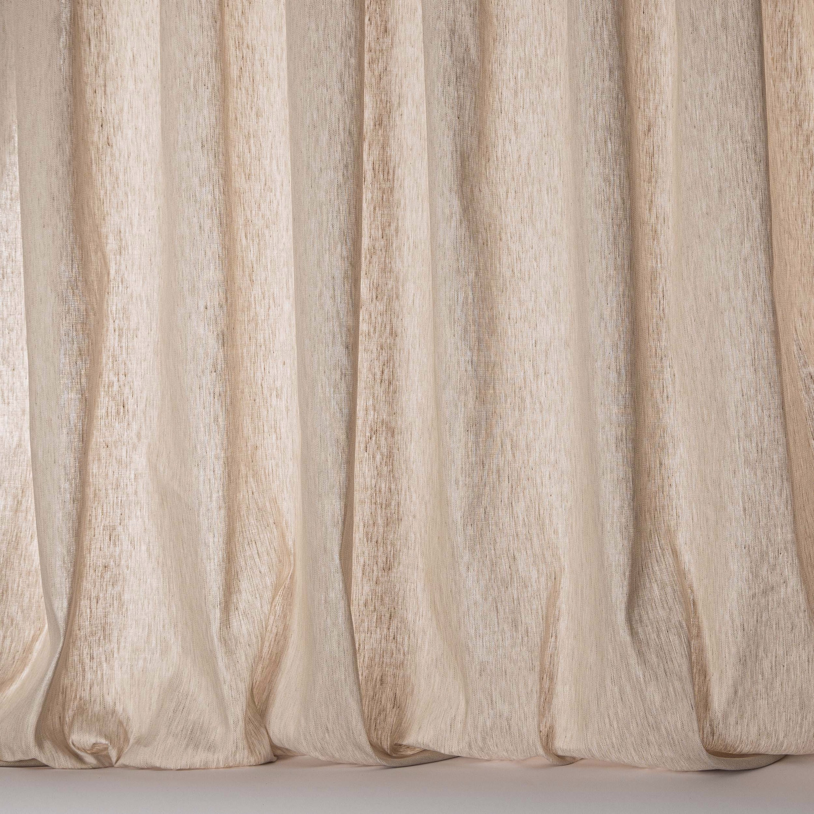 Warm natural sheer curtain fabric with soft linen texture and vertical folds