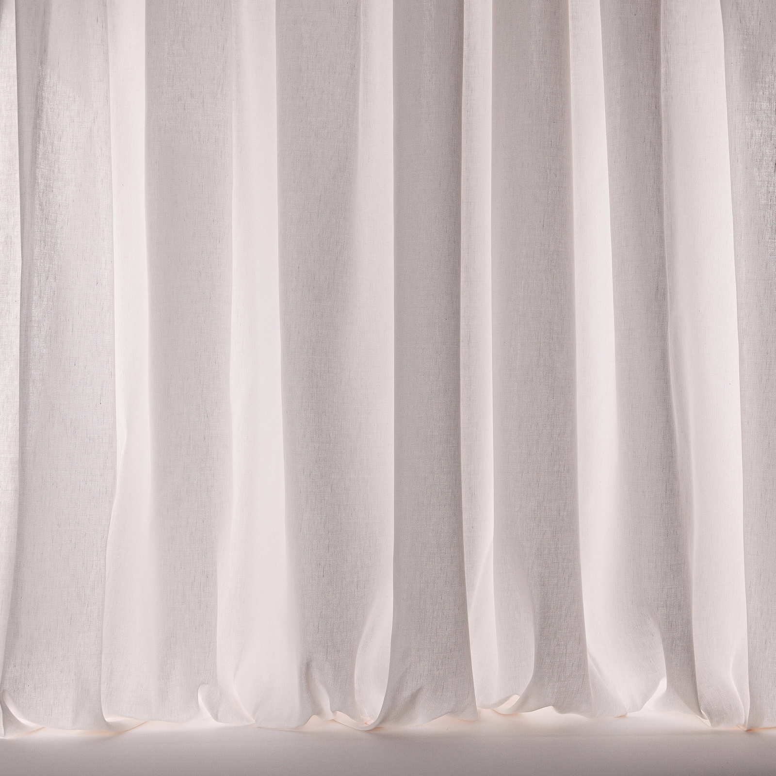 Soft polar white sheer curtains with subtle linen texture and gentle folds