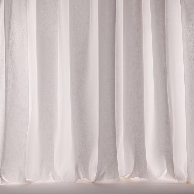 Soft polar white sheer curtains with subtle linen texture and gentle folds