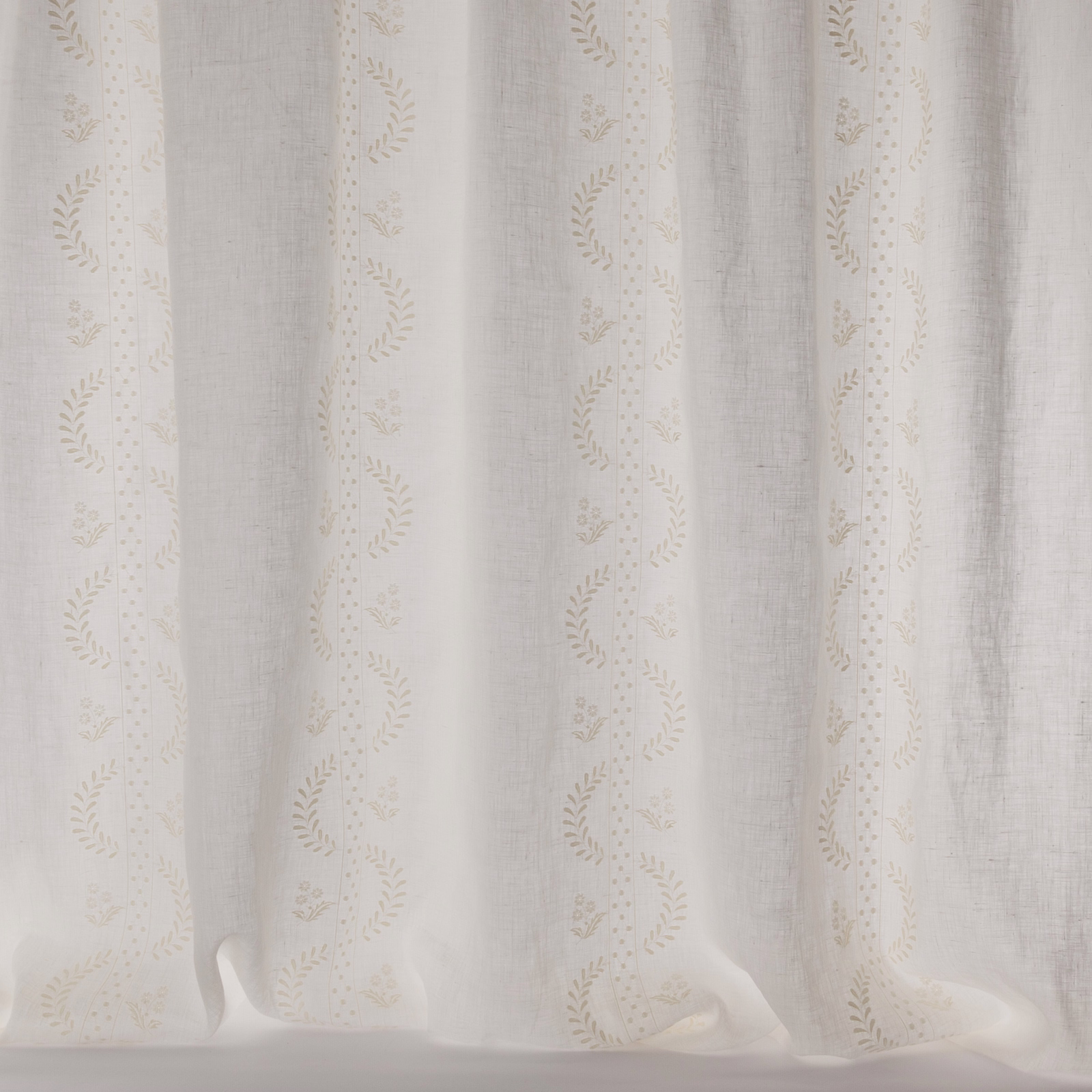 Ivory sheer curtain fabric with delicate embroidered vertical stripe pattern