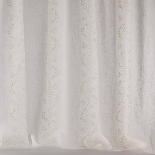 Ivory sheer curtain fabric with delicate embroidered vertical stripe pattern