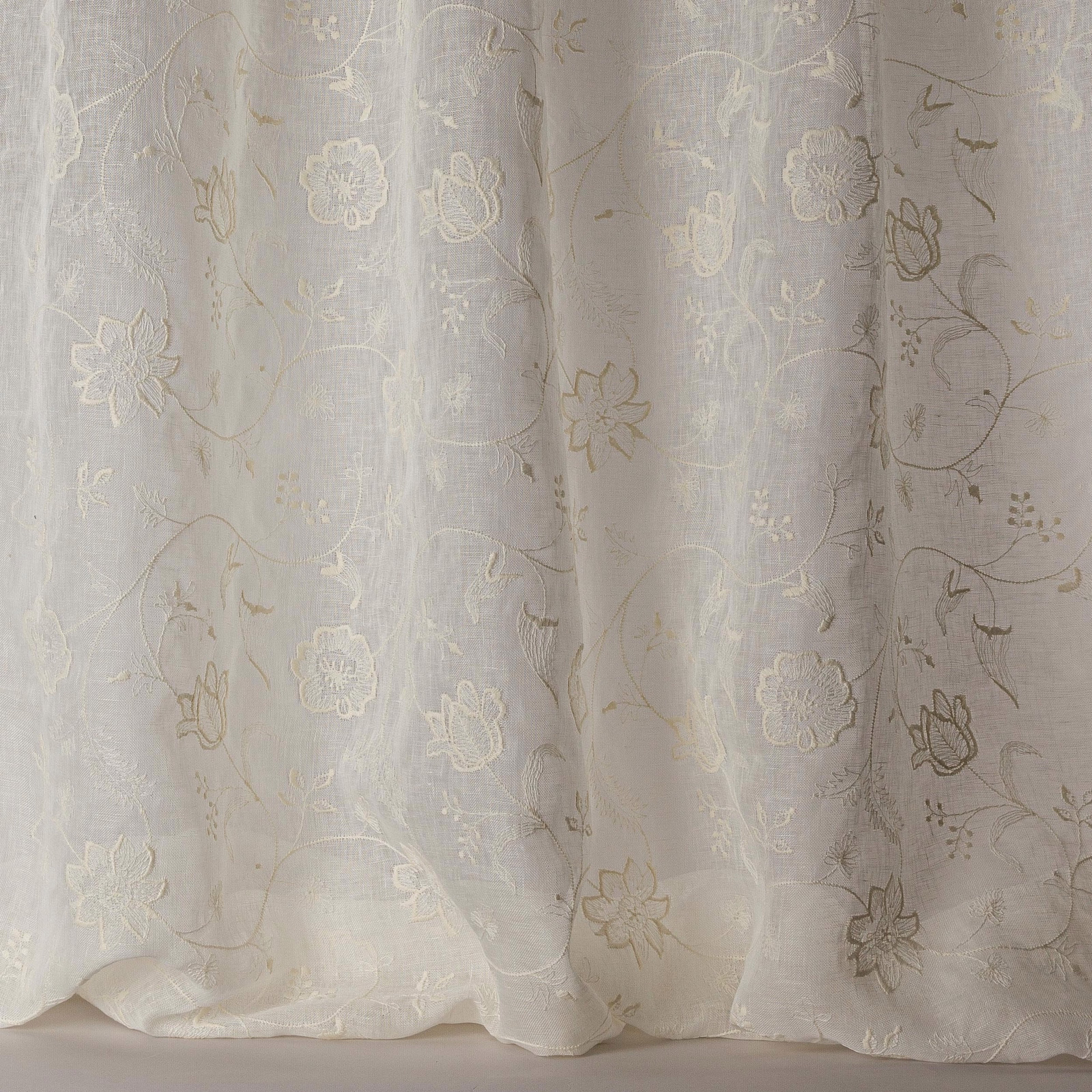 Sheer ivory floral voile with subtle embroidered vine trails and soft linen texture