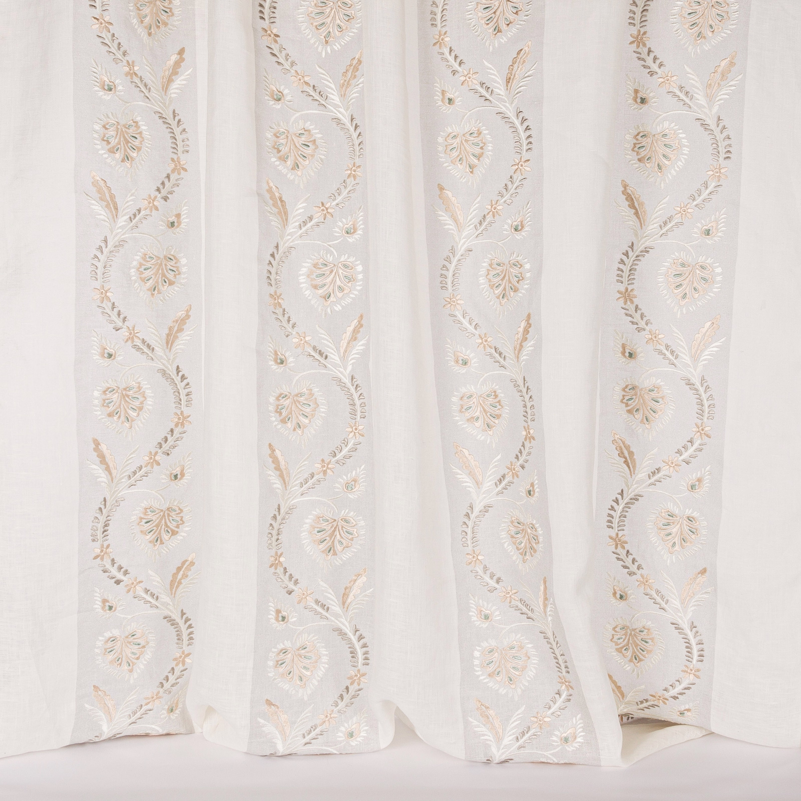 Pale silver sheer fabric with vertical embroidered floral vine stripes