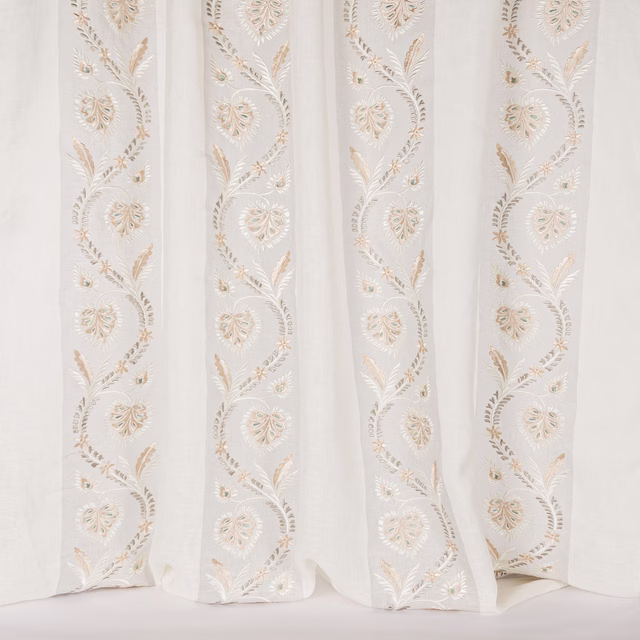 Pale silver sheer fabric with vertical embroidered floral vine stripes