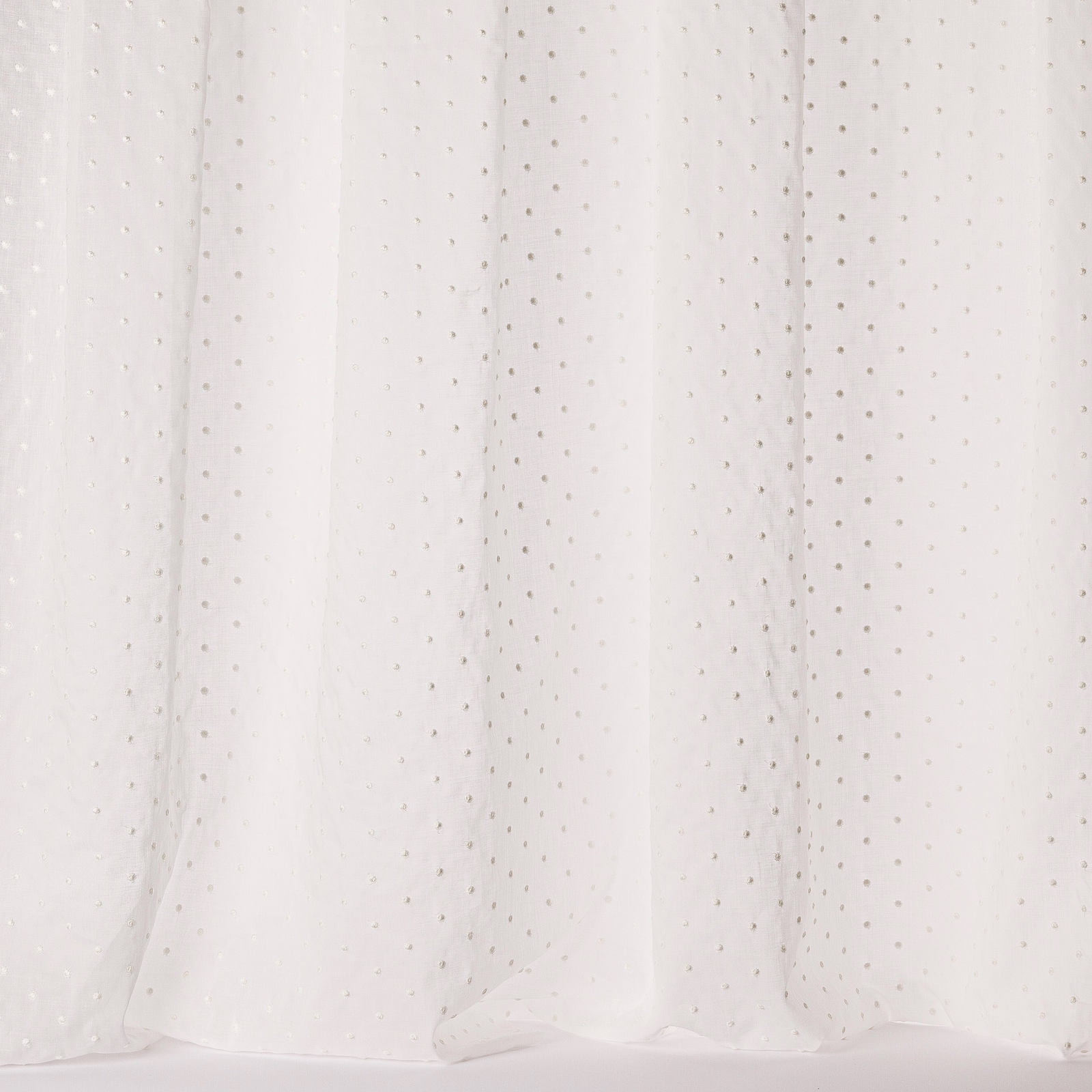 Sheer ivory cotton fabric with tiny dotted motif and soft drape