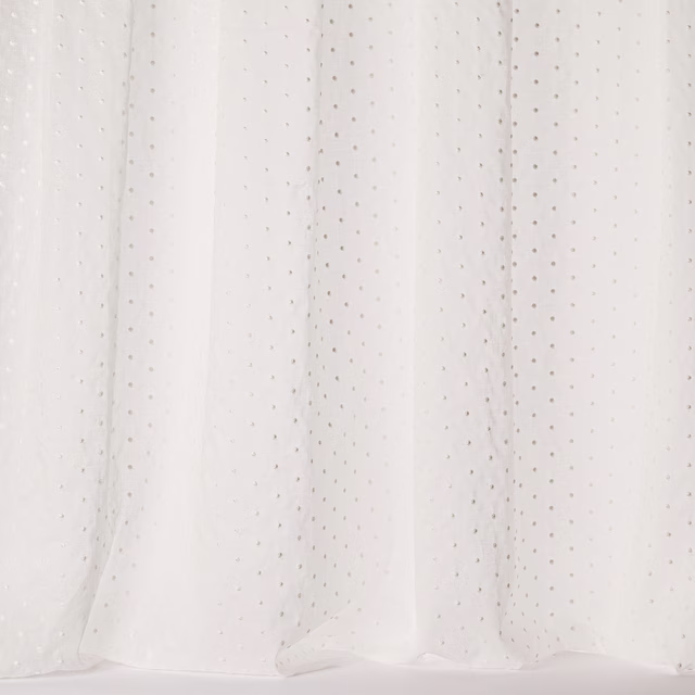 Sheer ivory cotton fabric with tiny dotted motif and soft drape
