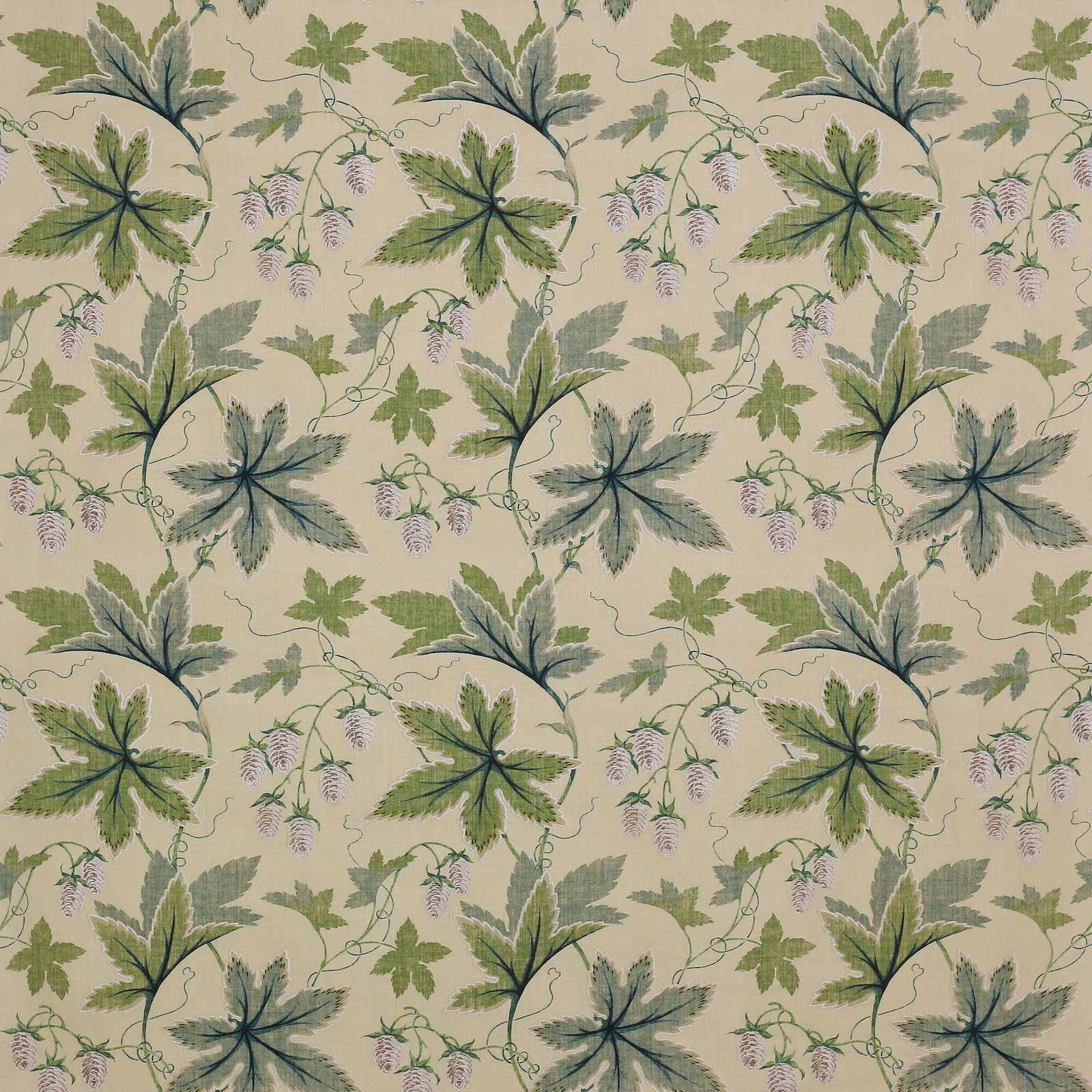 Large leafy botanical fabric in soft green and blue-green on a pale ground