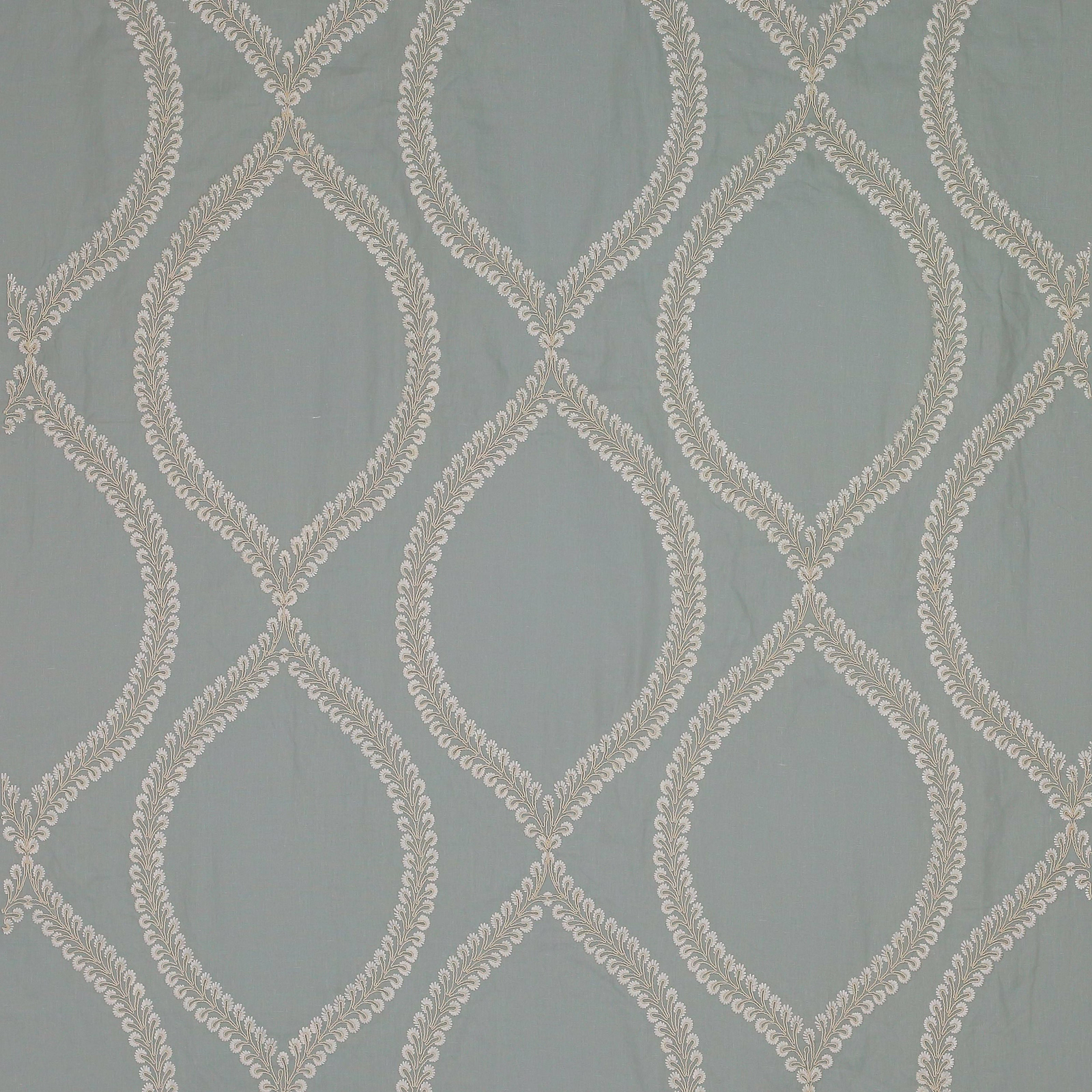 Soft old blue fabric with ivory leaf-lattice oval pattern