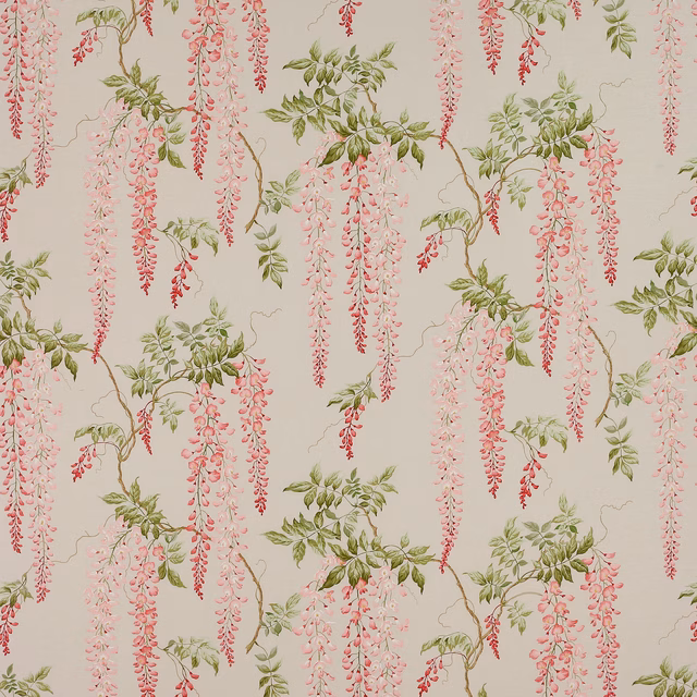 Printed fabric swatch with trailing pink wisteria and green leaves on a pale ground