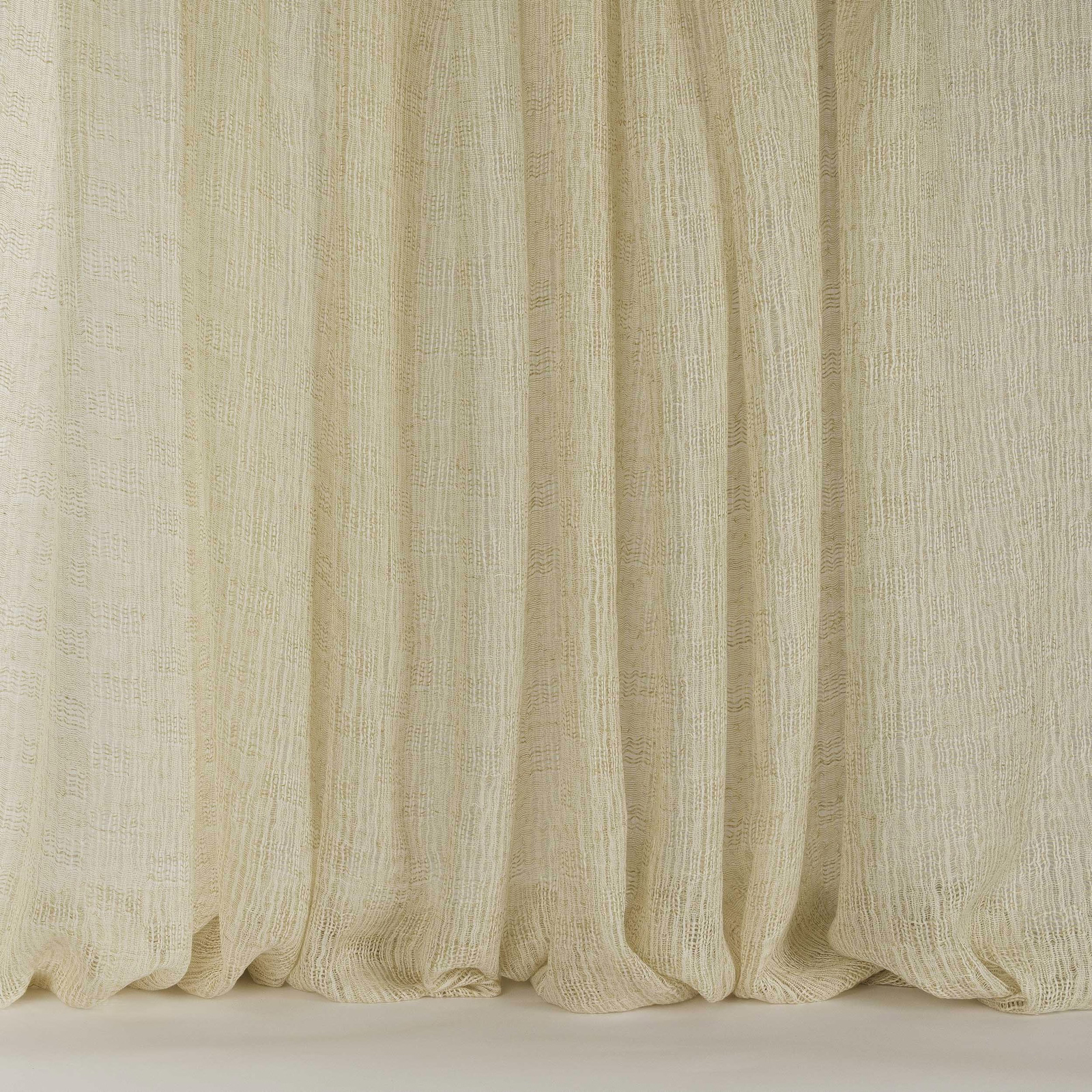 Pale sand-beige linen fabric with soft vertical drape and fine woven texture