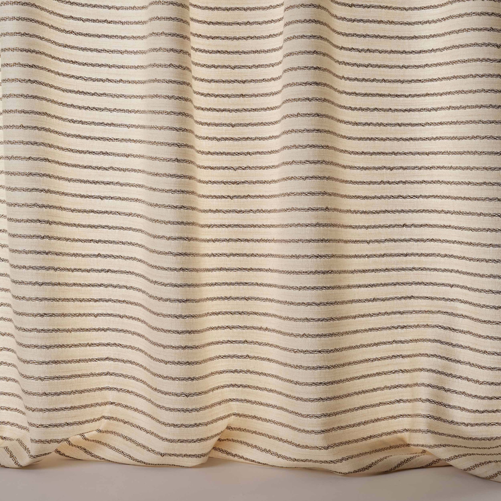 Creamy gold fabric with fine horizontal taupe stripes and a softly textured weave