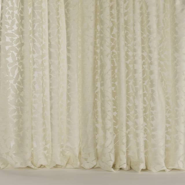 Creamy sand floral fabric with subtle woven texture and soft vertical folds