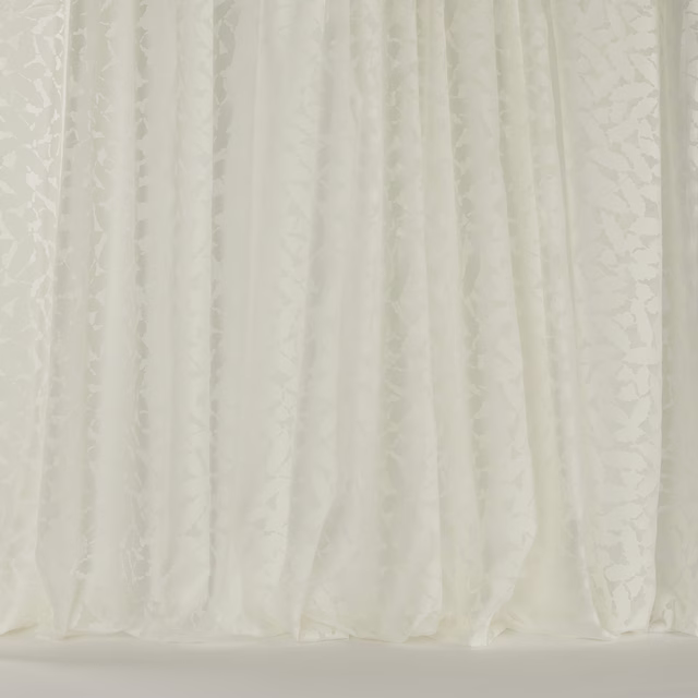 Soft ivory floral curtain fabric with subtle tonal texture and gentle folds
