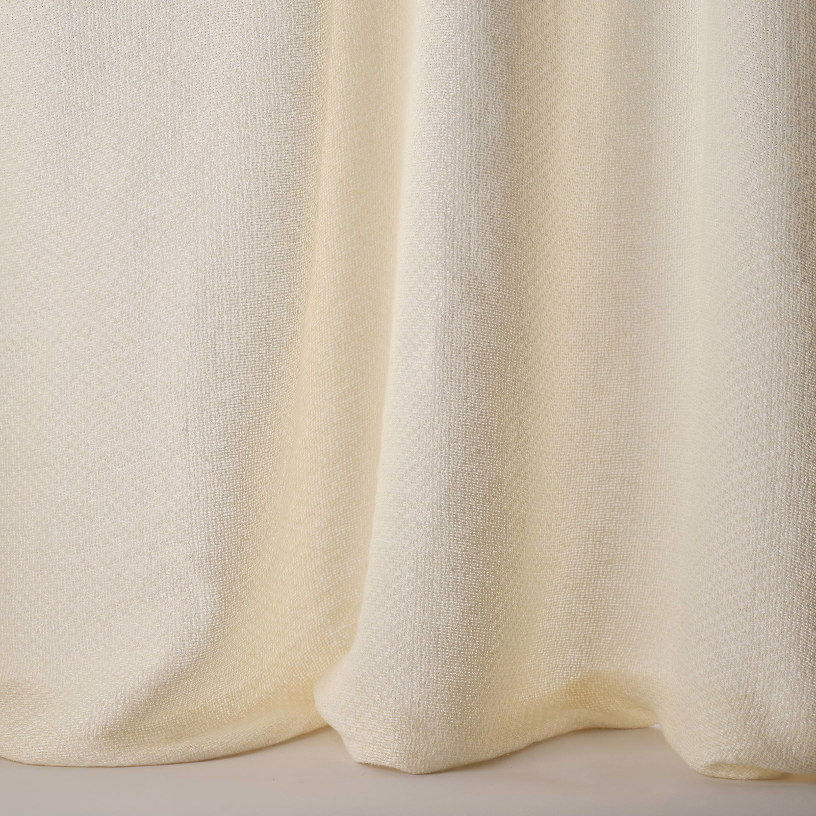 Soft cream plain fabric with fine weave and gentle drape